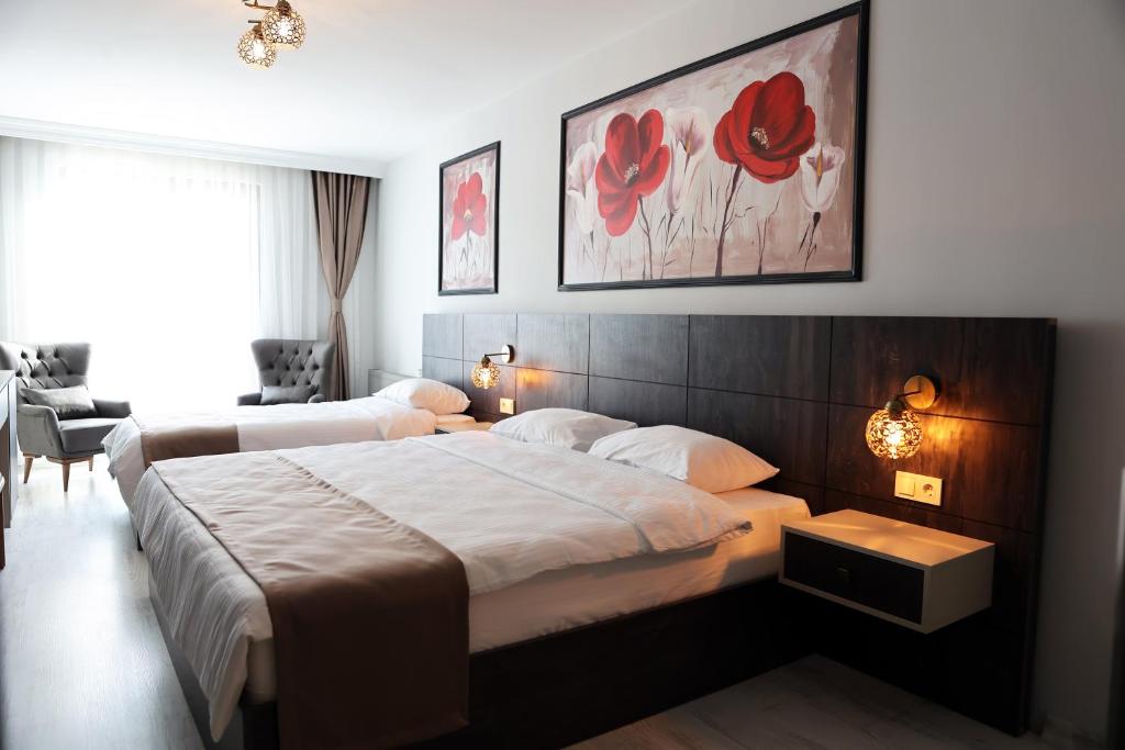 Postel nebo postele na pokoji v ubytování SAR-PER Hotel