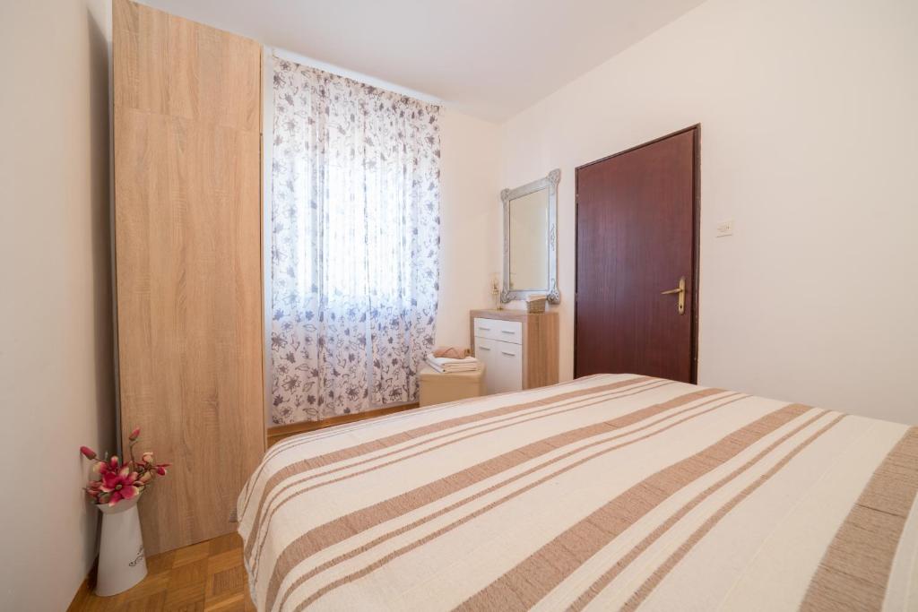 Posteľ alebo postele v izbe v ubytovaní Red Karmenita