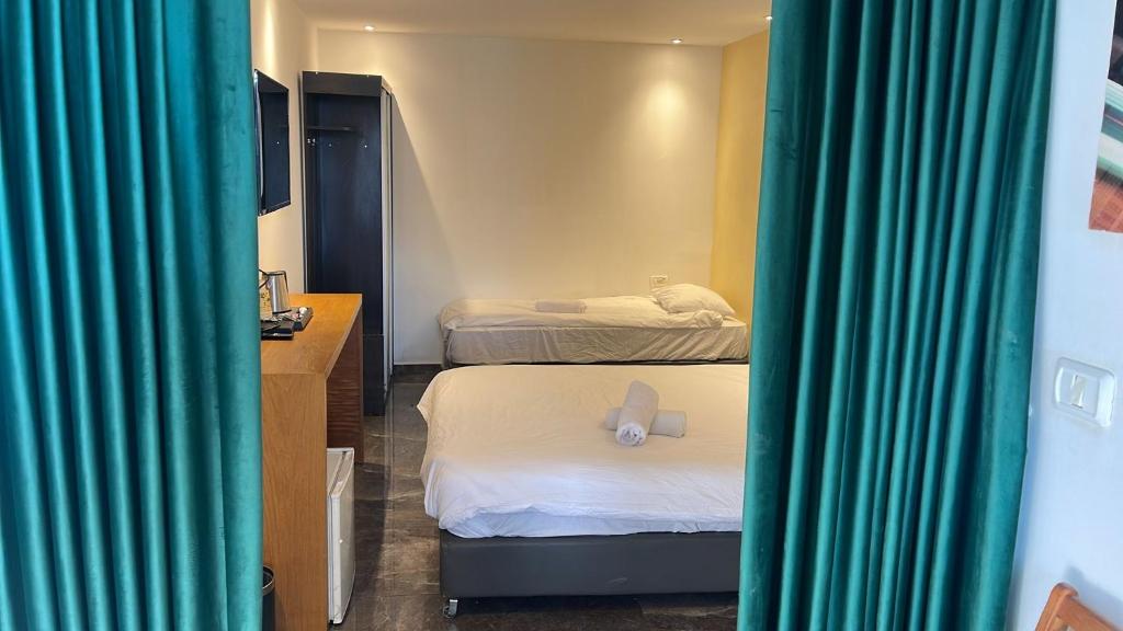 Postel nebo postele na pokoji v ubytování Elven Hotel