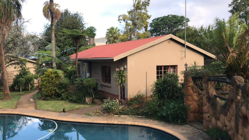 a house with a swimming pool in front of it at at 22 Symmonds in Melmoth