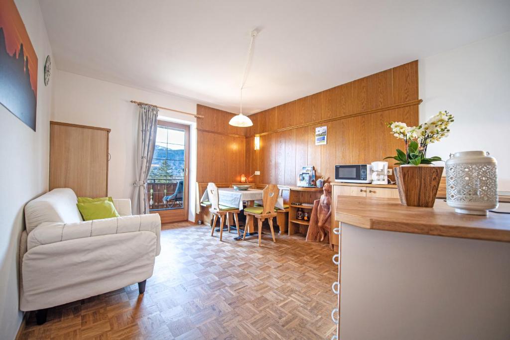 a kitchen and living room with a couch and a table at Bonichhof in Laion