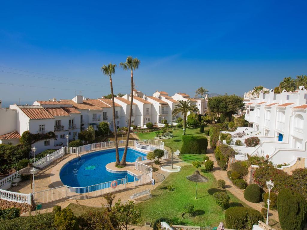 The swimming pool at or close to Holiday Home Jardines de Nerja by Interhome
