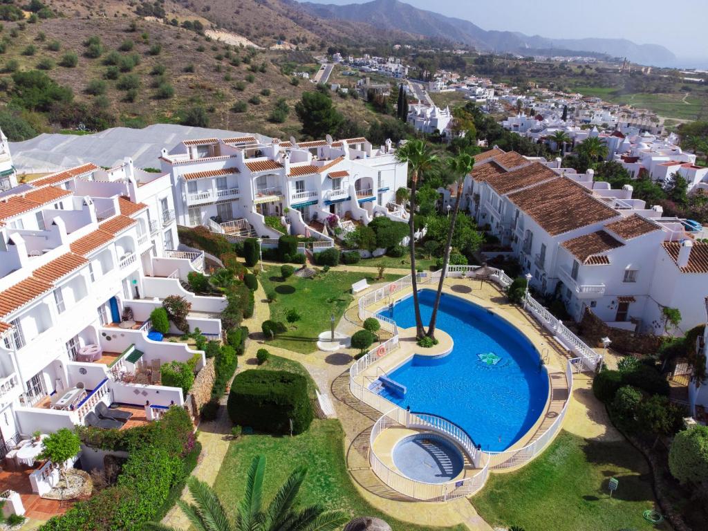 The swimming pool at or close to Holiday Home Jardines de Nerja by Interhome