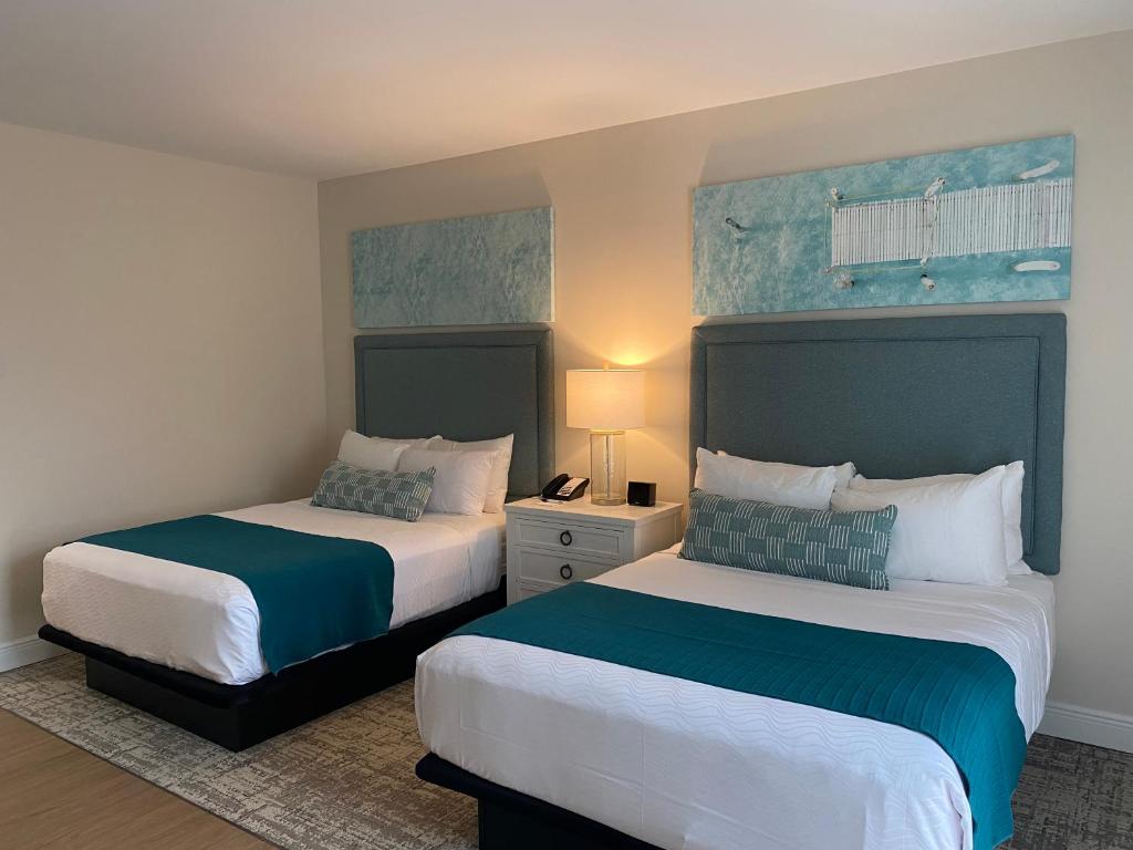 Postel nebo postele na pokoji v ubytování The Capri Inn