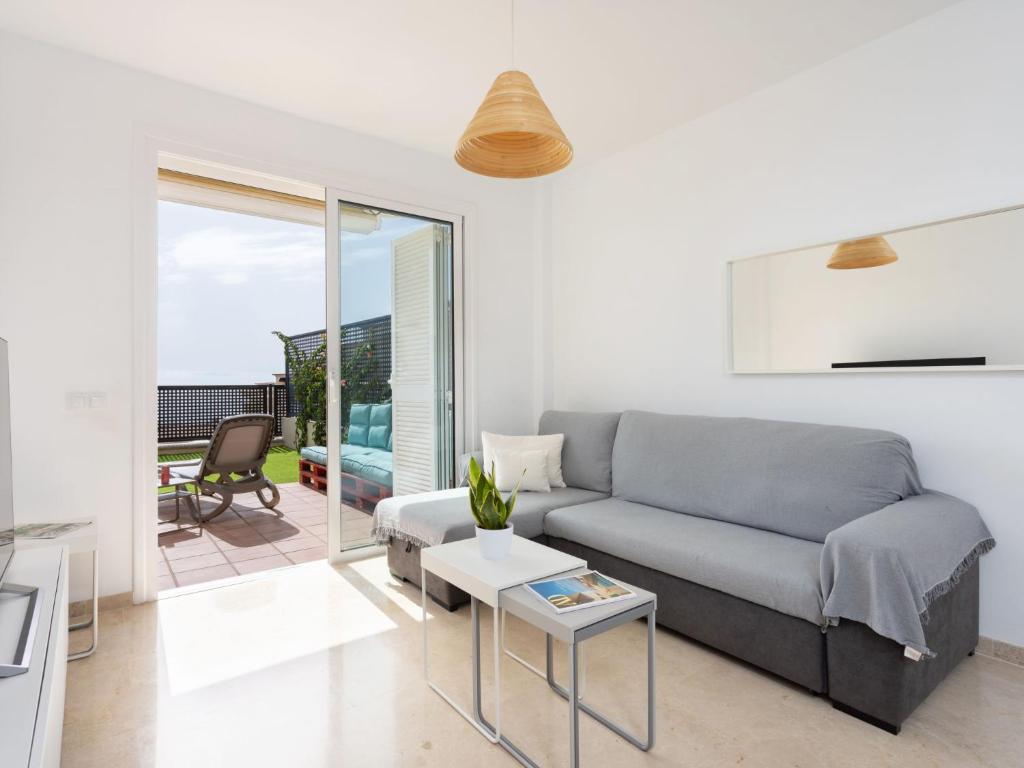 A seating area at Apartment Playa Negra II by Interhome