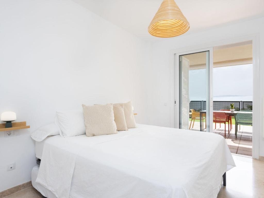 A bed or beds in a room at Apartment Playa Negra II by Interhome
