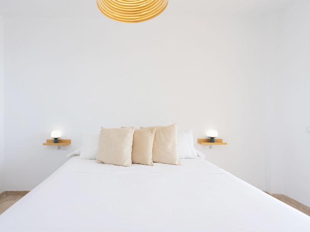 A bed or beds in a room at Apartment Playa Negra II by Interhome