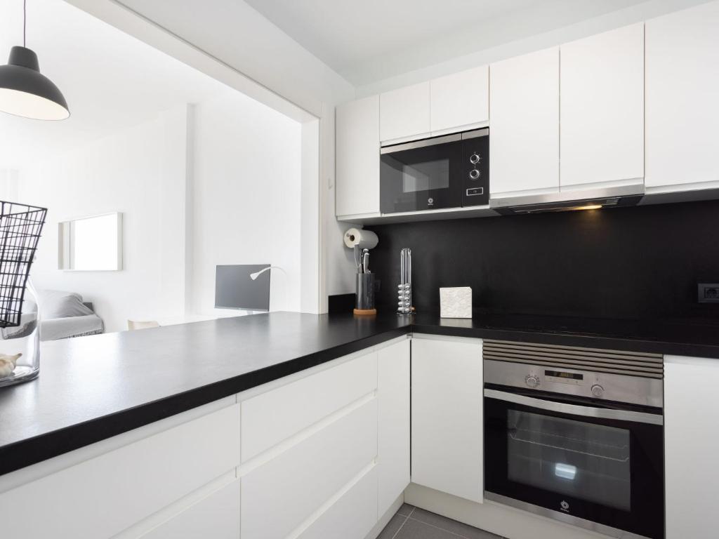 A kitchen or kitchenette at Apartment Playa Negra II by Interhome