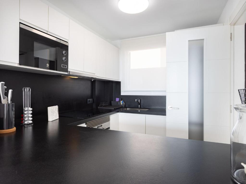 A kitchen or kitchenette at Apartment Playa Negra II by Interhome