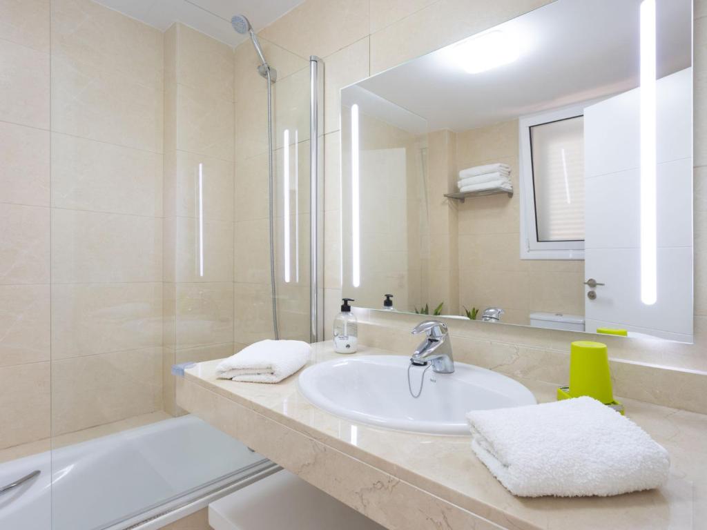 A bathroom at Apartment Playa Negra II by Interhome
