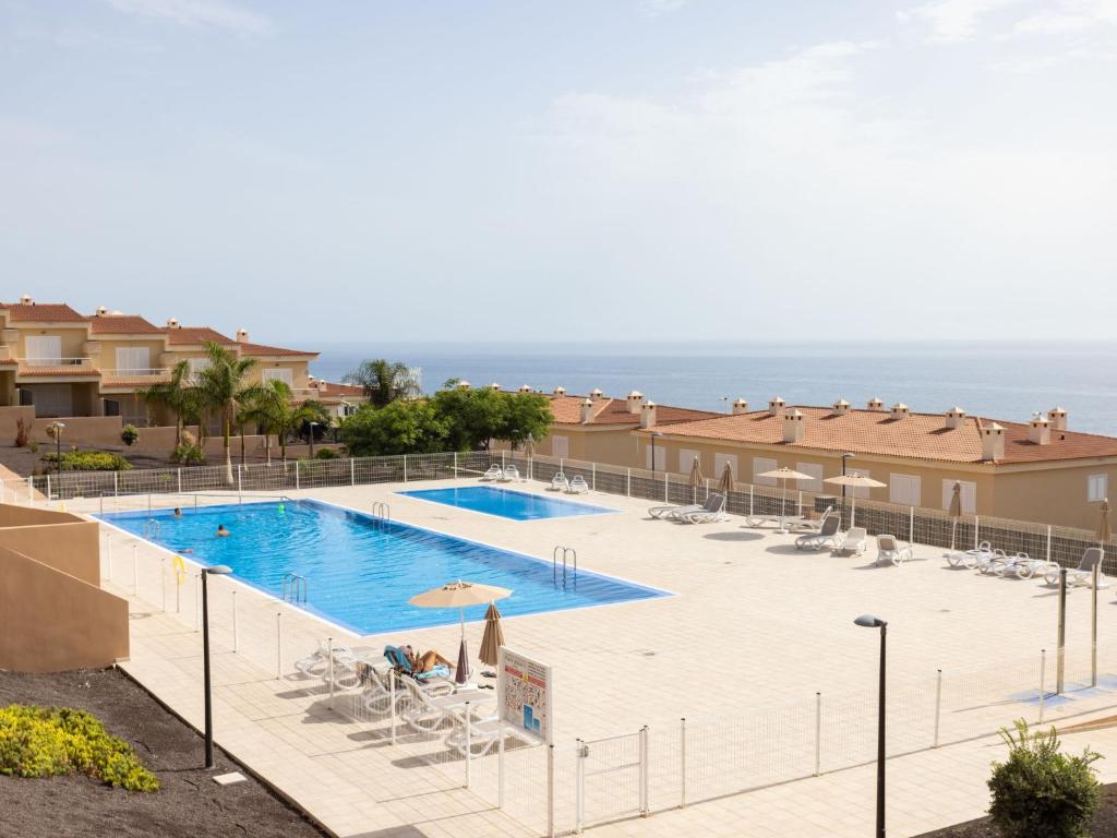 The swimming pool at or close to Apartment Playa Negra II by Interhome