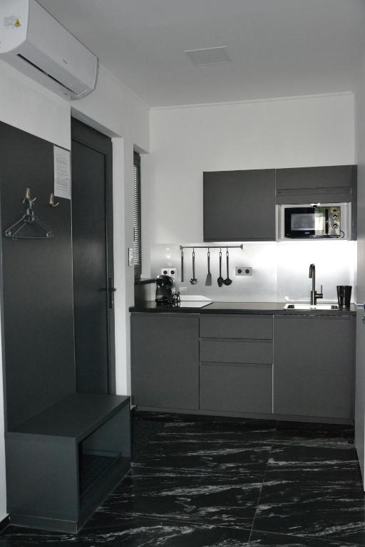 Kuchyň nebo kuchyňský kout v ubytování Apartmany u Polanských