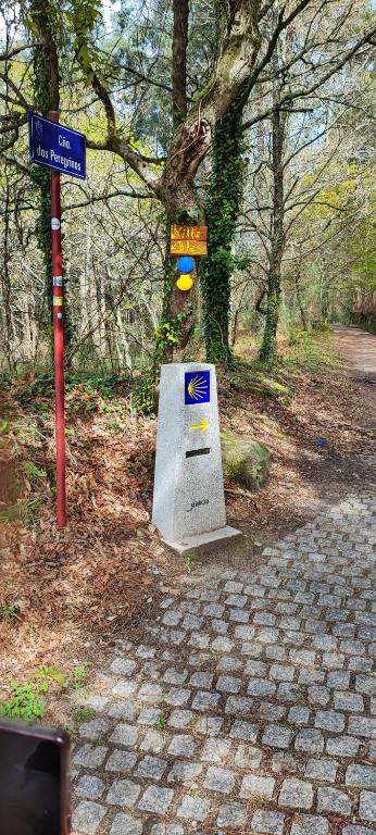 a street sign next to a brick road at Villa Blas in Redondela