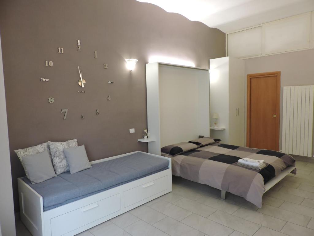 Letto o letti in una camera di Monolocale Via Cerquiglia, 136