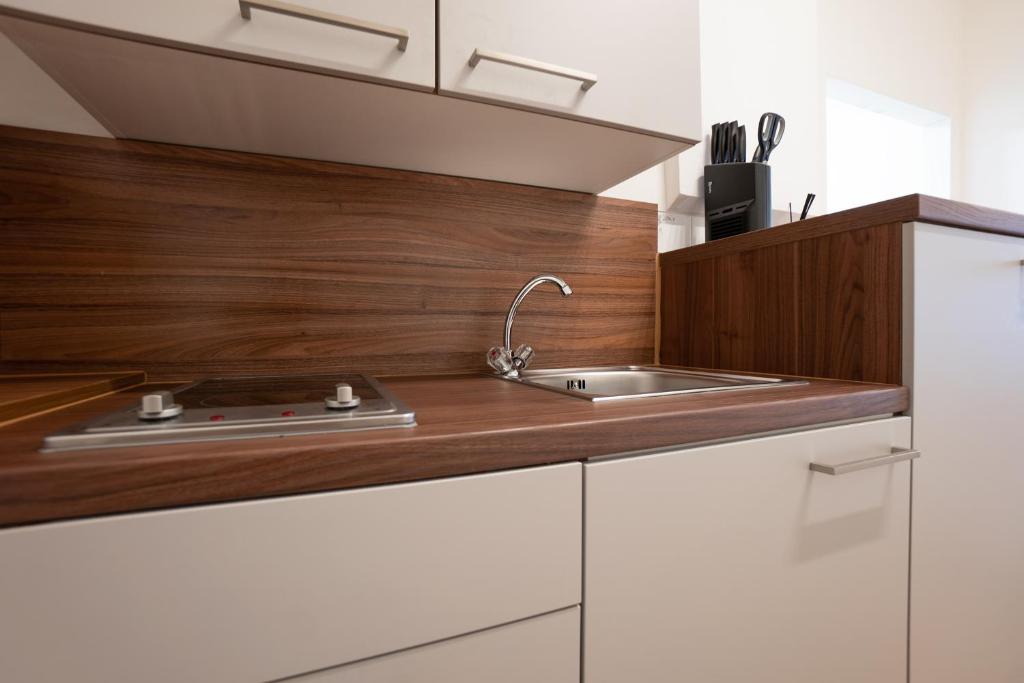A kitchen or kitchenette at Modern hotel-styled apartment in the second district of Vienna.