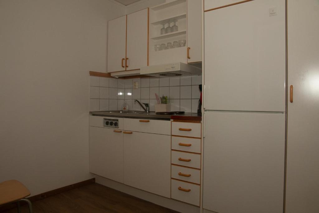 Kuchyň nebo kuchyňský kout v ubytování HusHotellHunge AB