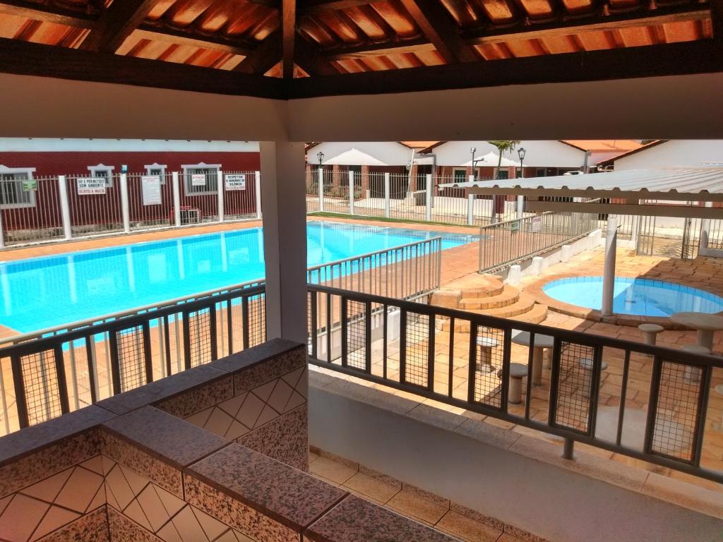 a view of the pool from the balcony of a hotel at Pousada Recanto Paraíso Família in Caldas Novas