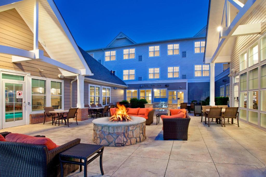 a patio with a fire pit in front of a building at Residence Inn Bridgewater Branchburg in Branchburg Park