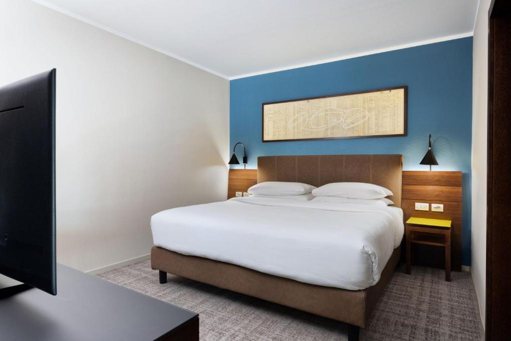 Łóżko lub łóżka w pokoju w obiekcie Four Points Sheraton Bolzano Bozen