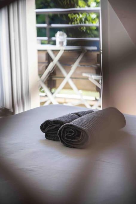 a pair of towels sitting on top of a bed at L’appart Lodge 106 in Sévrier