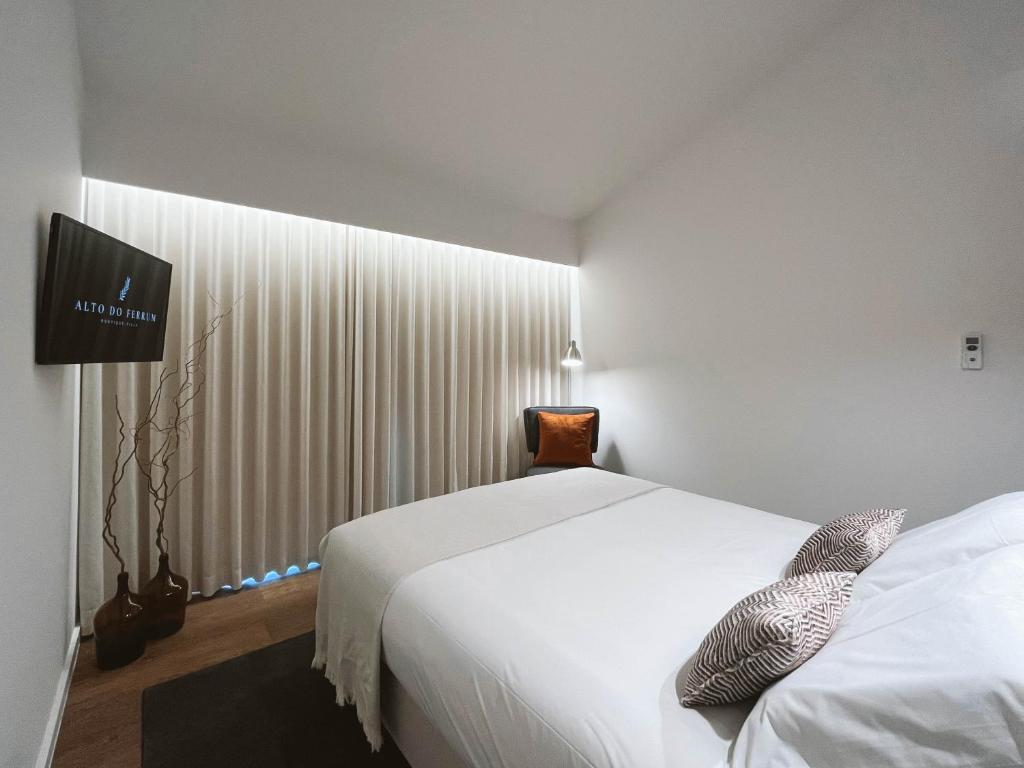 Postel nebo postele na pokoji v ubytování Alto do Ferrum - Boutique Villa