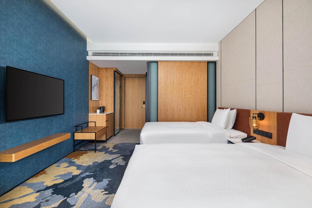 Letto o letti in una camera di Four Points by Sheraton Shanghai Jiading
