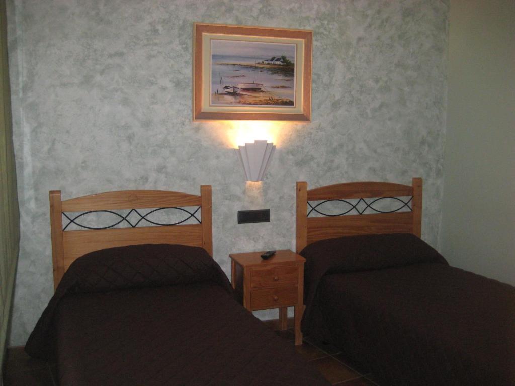 Postel nebo postele na pokoji v ubytování Hostal Guarni