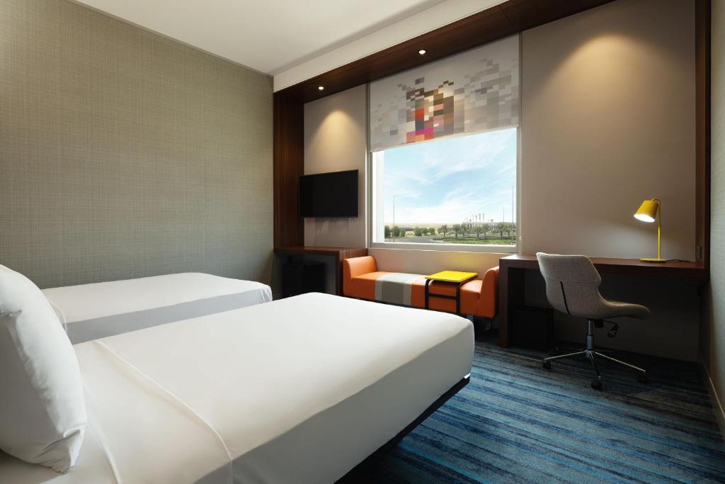 
Aloft Room – Twin Bed (Complimentary Shuttle to Expo Metro Station & Al Maktoum International Airport)
