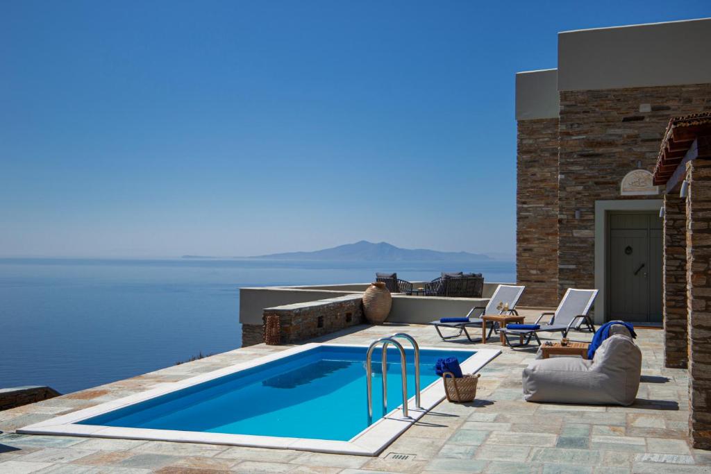 a swimming pool on the roof of a villa at Acron Andros - Luxury Villa with Private Pool in Andros