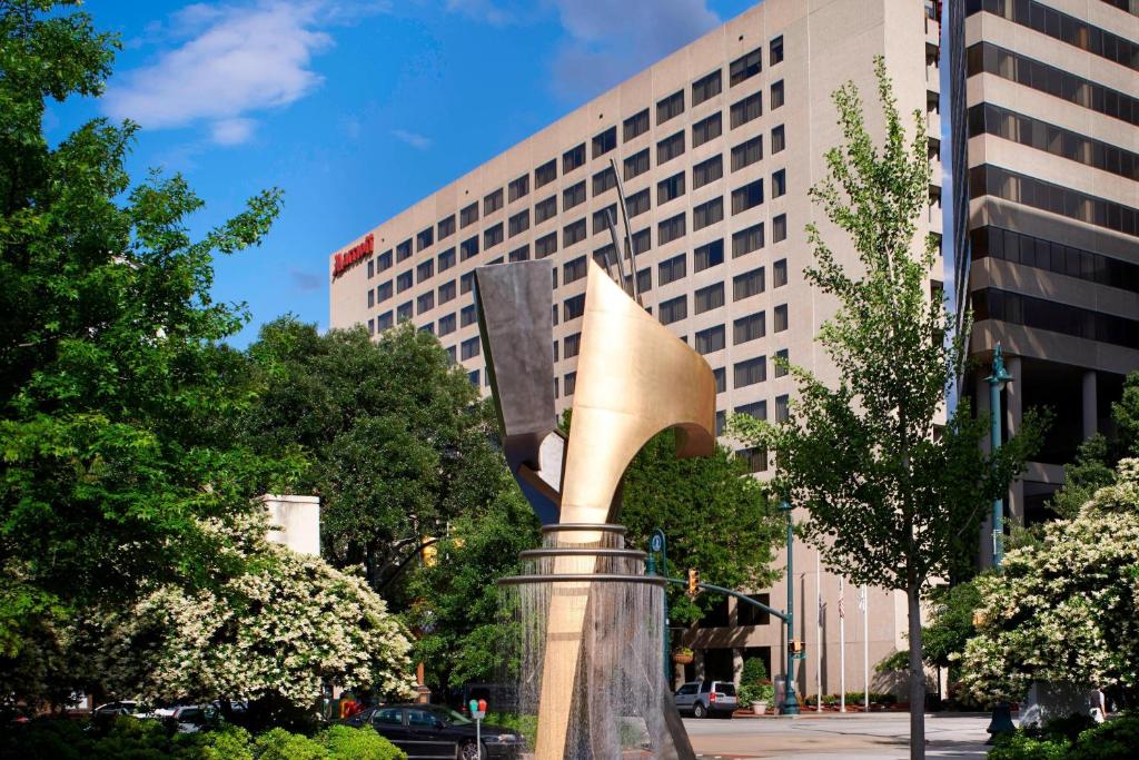 a statue in front of a tall building at Marriott Columbia in Columbia