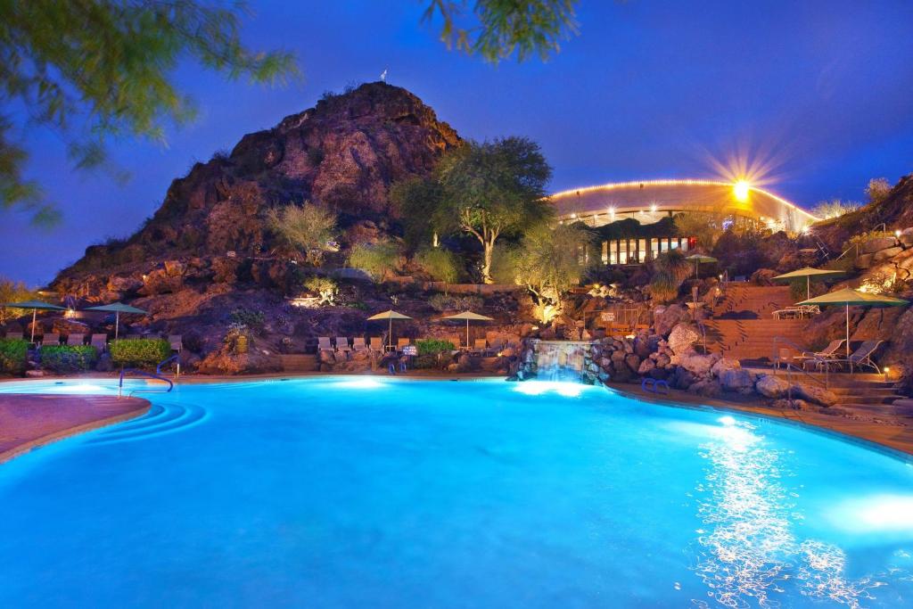 a pool at a resort with a mountain in the background at Phoenix Marriott Resort Tempe at The Buttes in Tempe