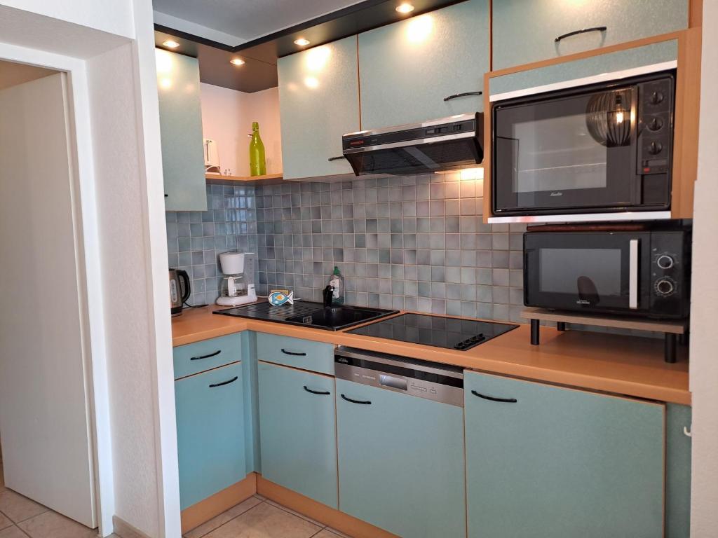 Kuchyňa alebo kuchynka v ubytovaní Ancora2- Appartement vue mer et place de parking
