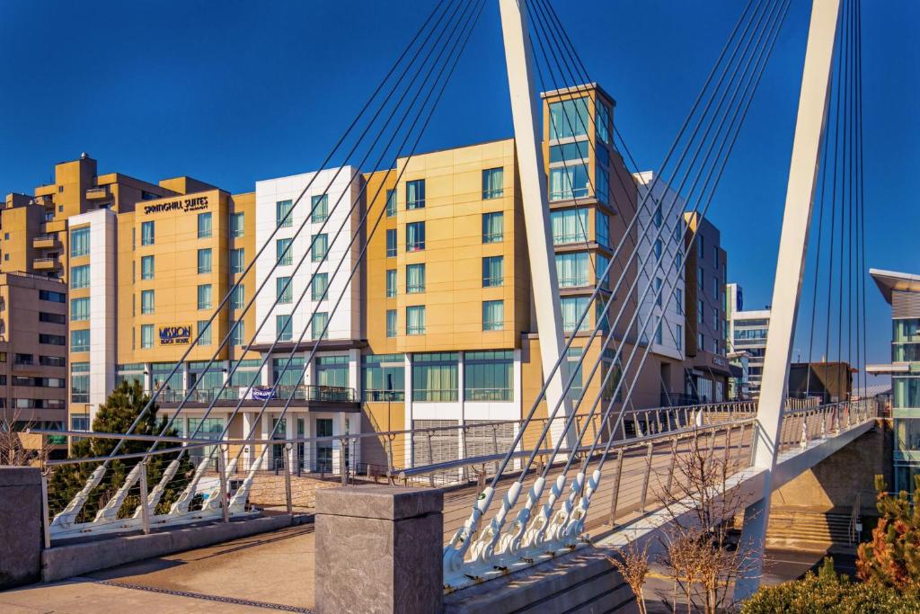 a suspension bridge in a city with buildings at SpringHill Suites by Marriott Boston Logan Airport Revere Beach in Revere