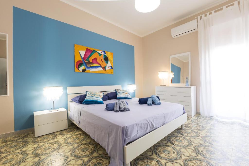 A bed or beds in a room at La Casa di Annale'