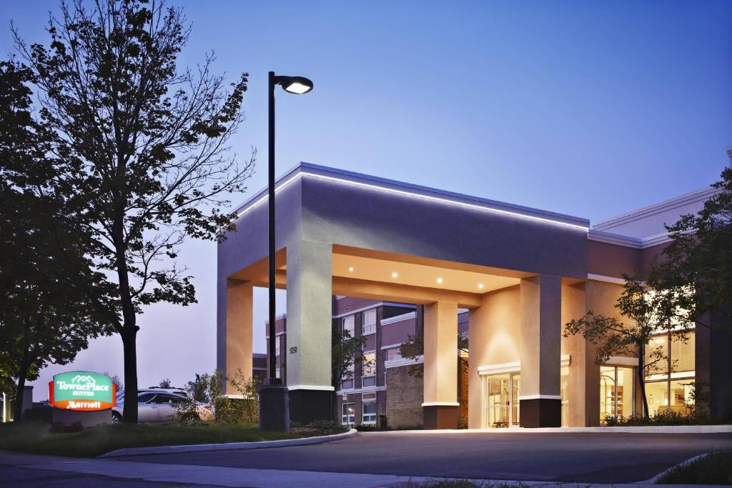 a building with a street light in front of it at TownePlace Suites by Marriott Mississauga-Airport Corporate Centre in Mississauga