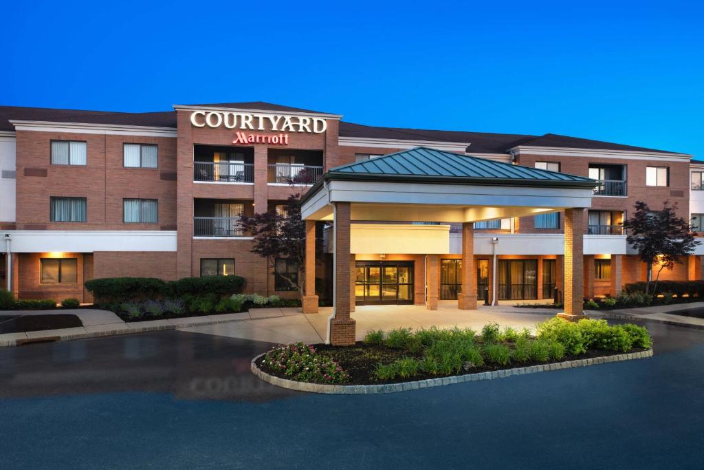 a hotel with a gazebo in front of a building at Courtyard by Marriott West Orange in West Orange