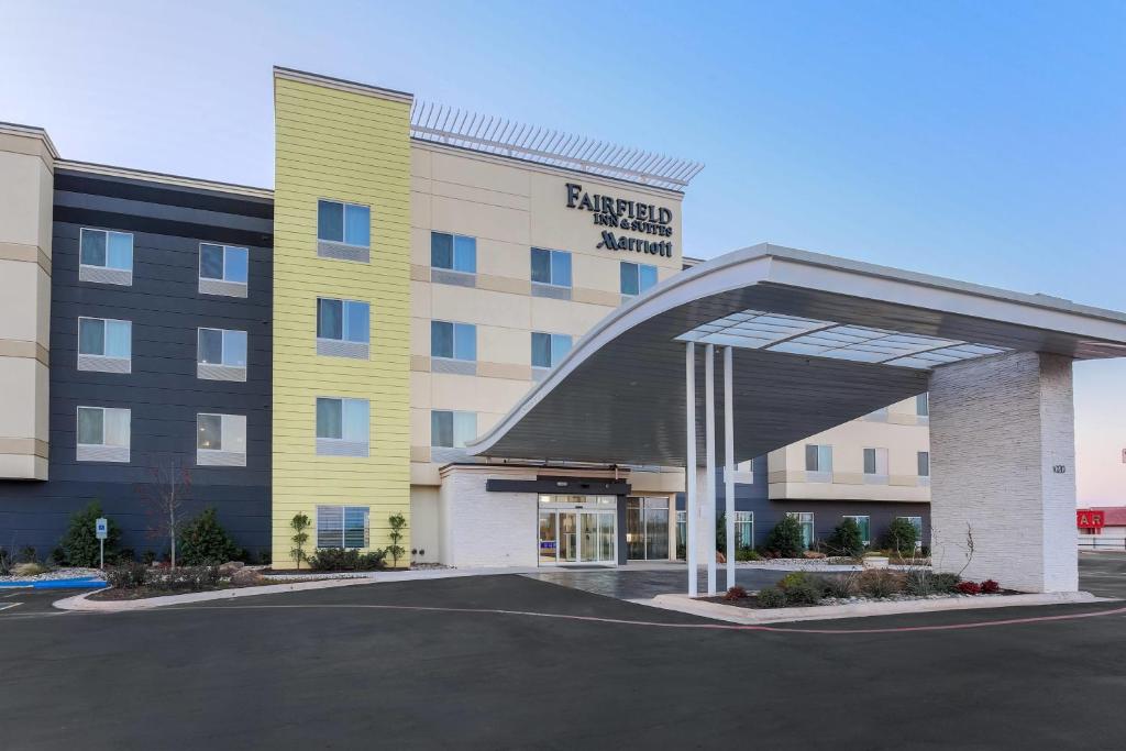 a hotel building with a parking lot in front of it at Fairfield Inn & Suites by Marriott Wichita Falls Northwest in Wichita Falls