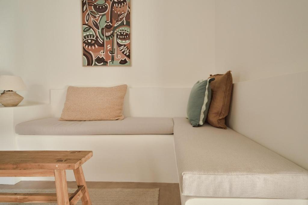a living room with a couch and a table at Casa Uva - Boutique Guest House in Vejer de la Frontera