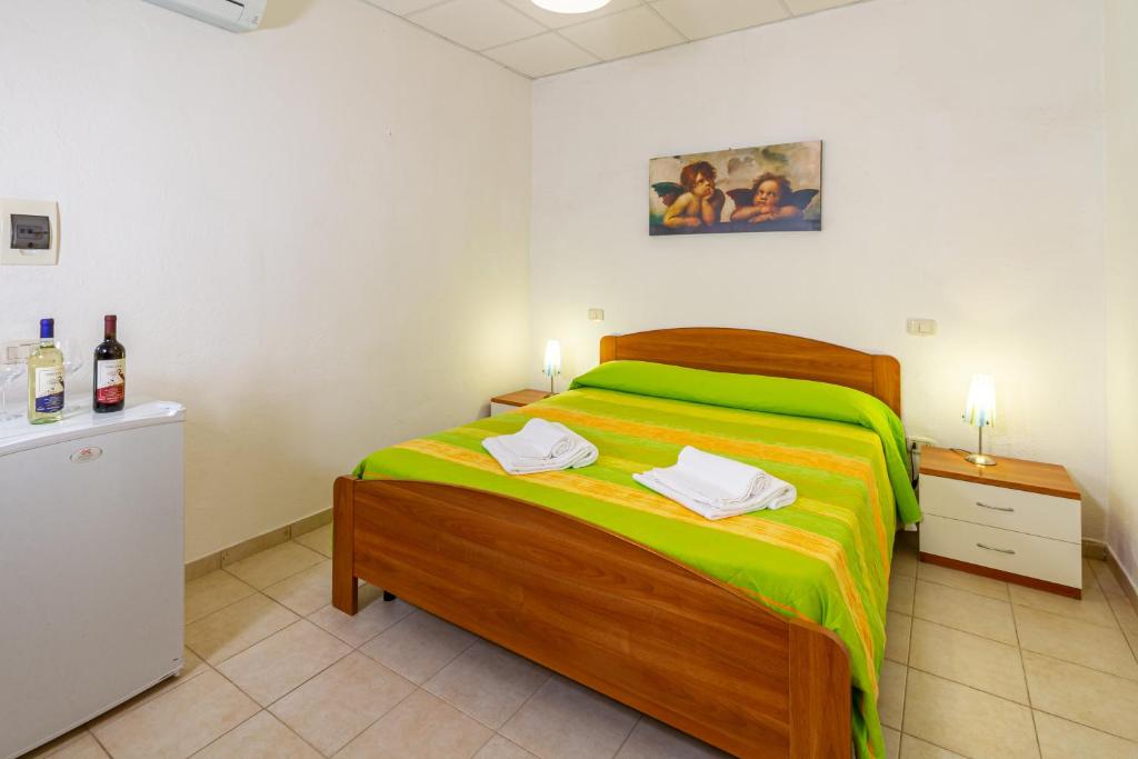 Postel nebo postele na pokoji v ubytování Agriturismo Fusini
