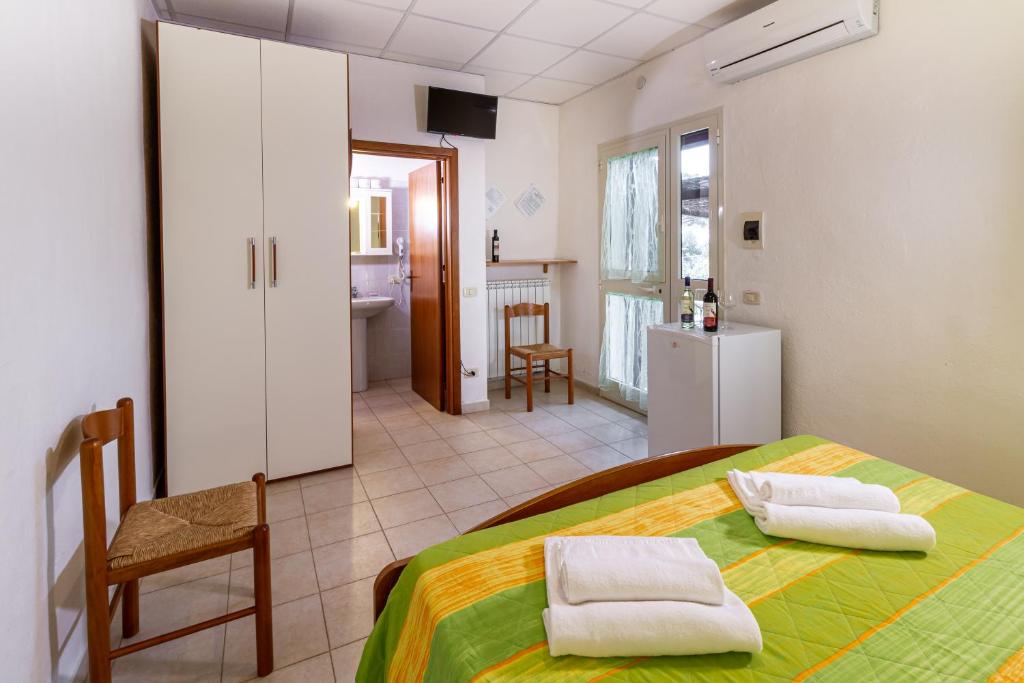 Postel nebo postele na pokoji v ubytování Agriturismo Fusini