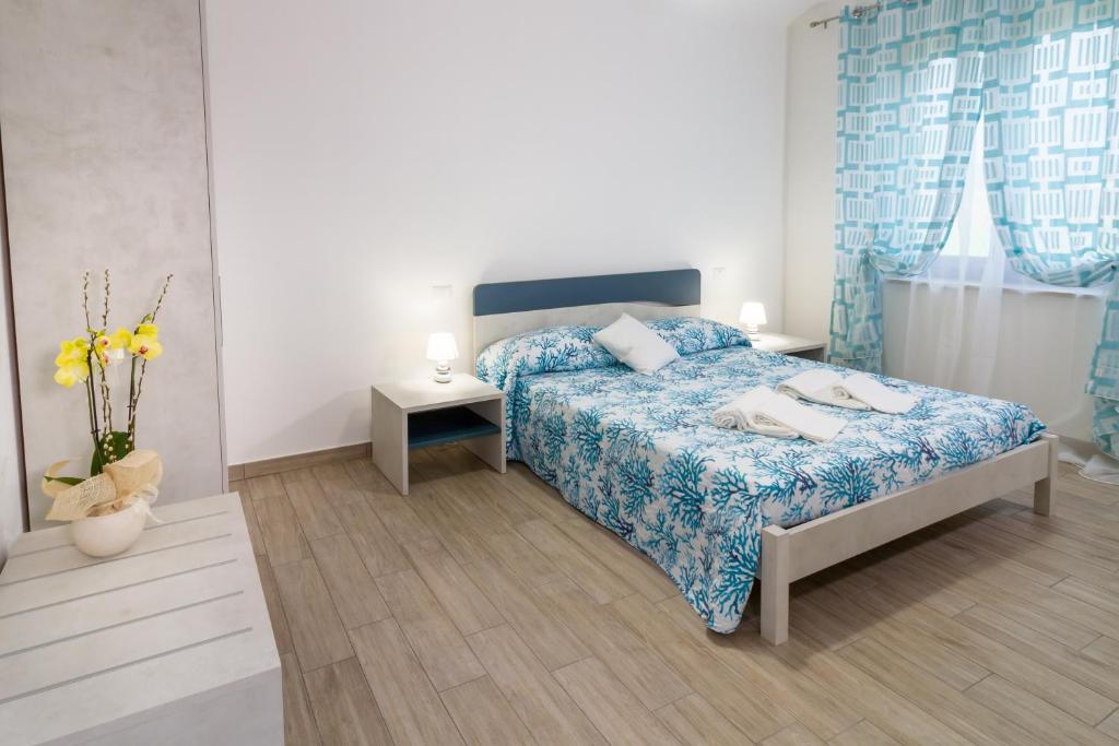 Postel nebo postele na pokoji v ubytování Agriturismo Fusini