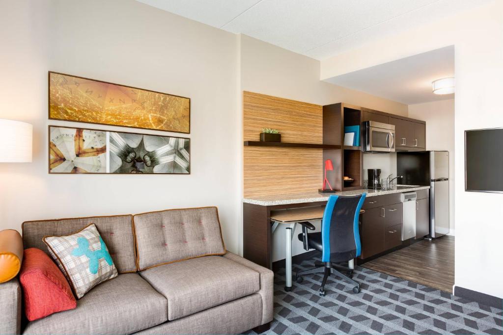 a living room with a couch and a desk at TownePlace Suites by Marriott Memphis Southaven in Southaven