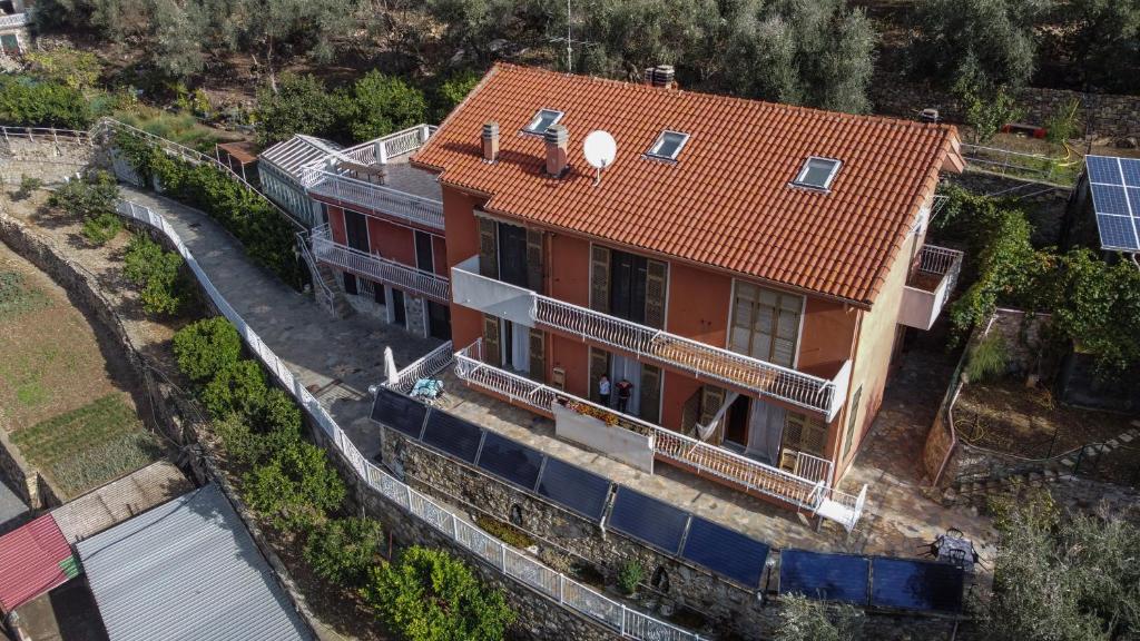 an overhead view of a house with a red roof at Agriturismo La Rocca in San Bartolomeo al Mare