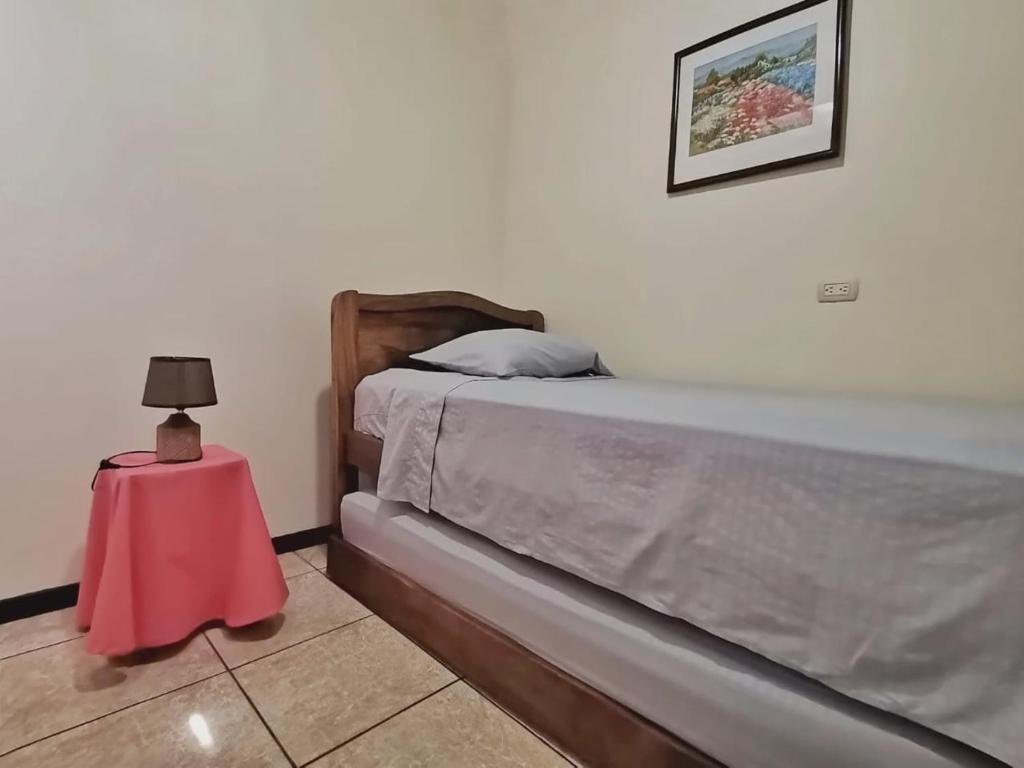 Postel nebo postele na pokoji v ubytování Casa Cafetal Aeropuerto