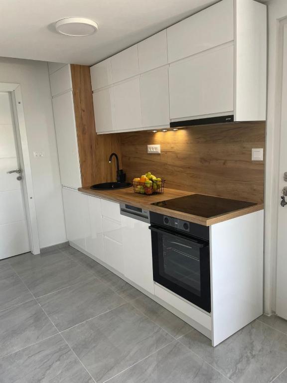 Kuchyň nebo kuchyňský kout v ubytování Apartment Olyntha