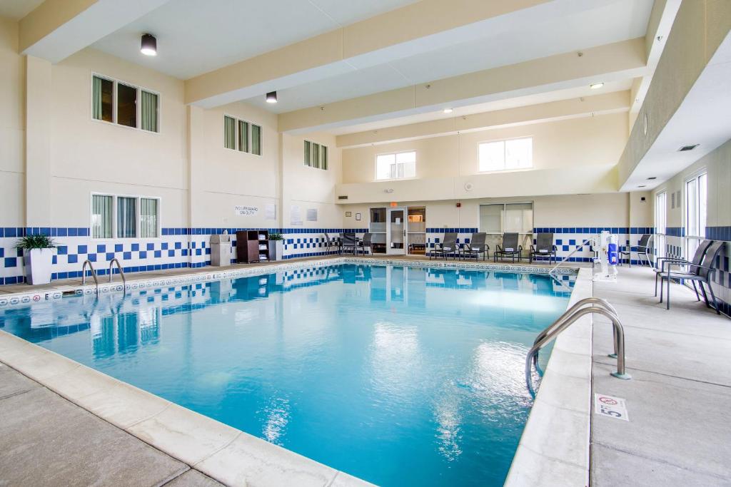 a large pool with blue water in a building at Fairfield Inn & Suites by Marriott Nashville at Opryland in Nashville