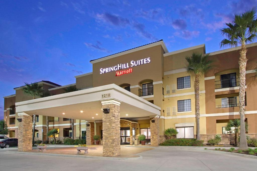 a hotel with a sign on the front of it at SpringHill Suites by Marriott Madera in Madera