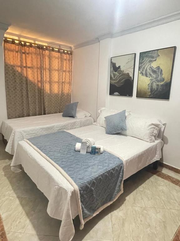 Ein Bett oder Betten in einem Zimmer der Unterkunft Hospedaje él Familia