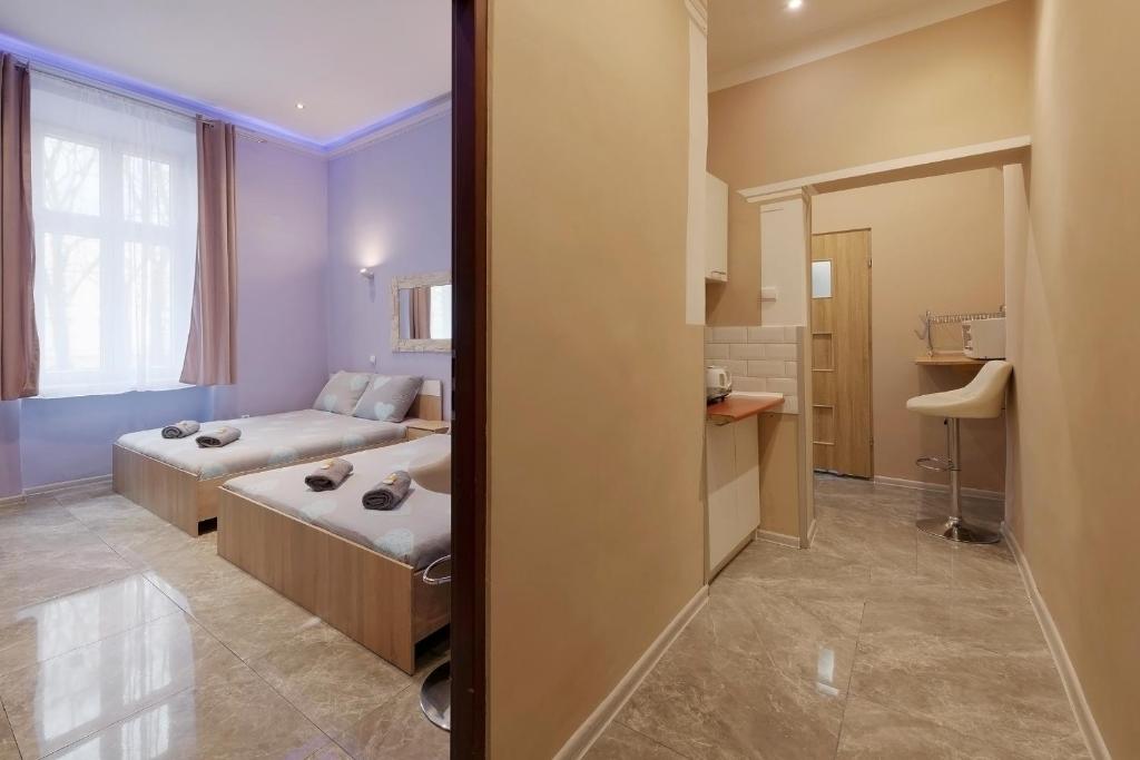 Posteľ alebo postele v izbe v ubytovaní Queen Apartments