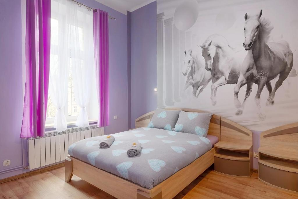 Posteľ alebo postele v izbe v ubytovaní Queen Apartments